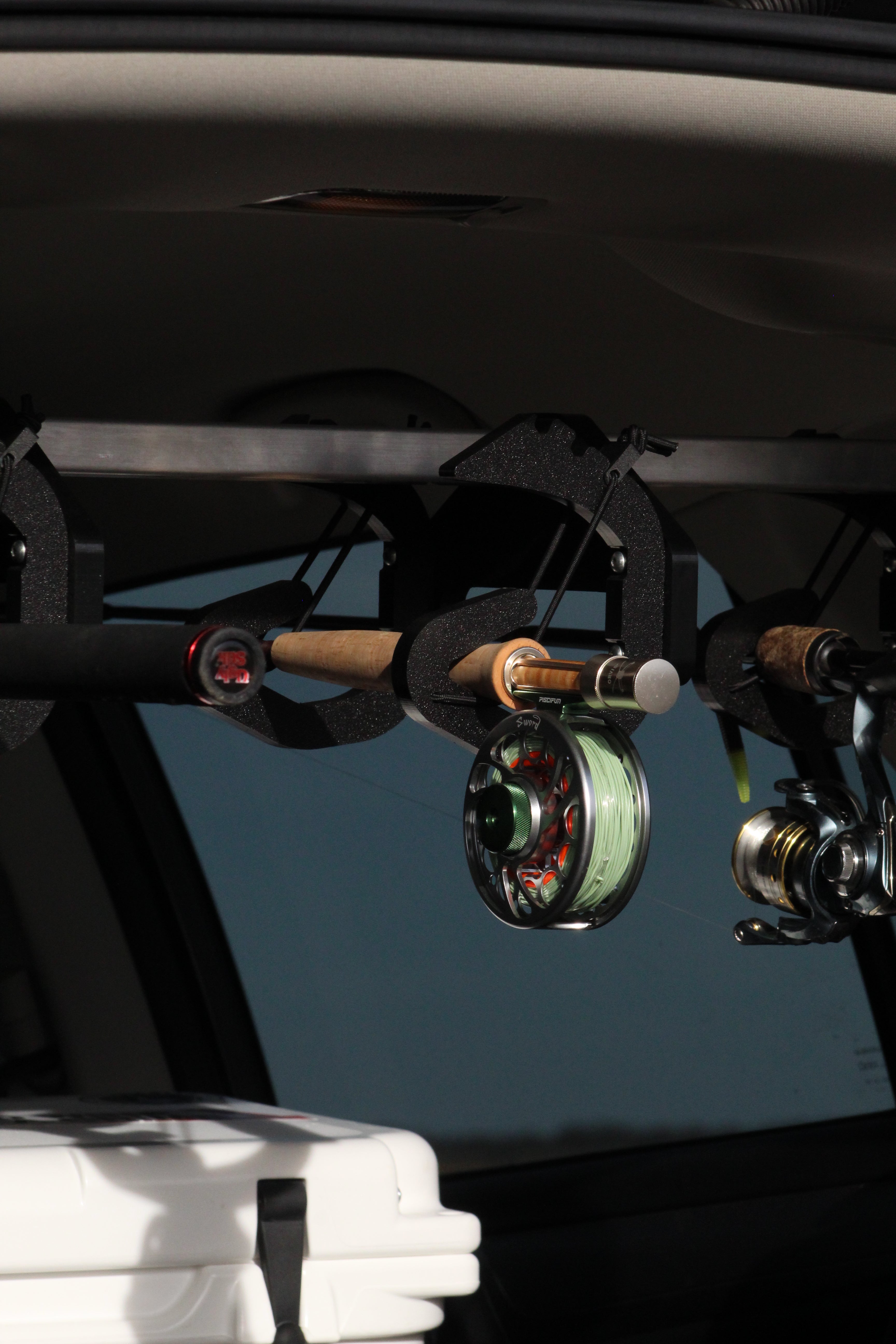 Rod Rig holding a fly rod. In-vehicle fishing rod carrier.
